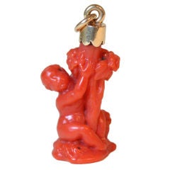 small coral sculpture of a putto