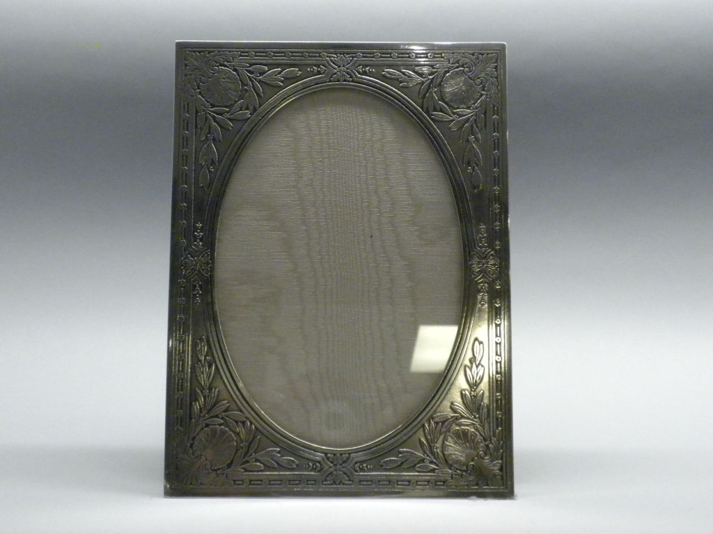 An American sterling silver picture frame decorated with an acid etched design of shells, leaves and floral fenced border. Made by Tiffany & Co., New York, circa 1910.Fully hallmarked including the 