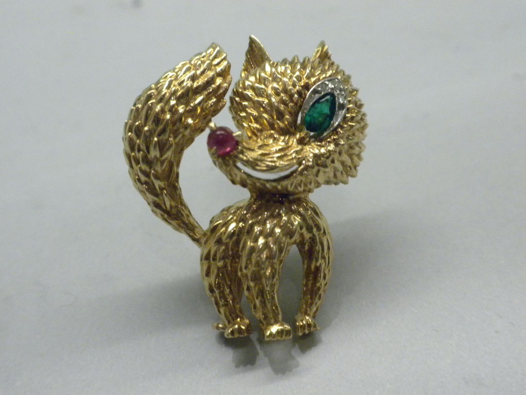 Delightful Van Cleef & Arpels, Paris, France Diamond, Ruby and Emerald Set 18 Karat Yellow Gold Fox Brooch, Circa 1960.  Signed:  VCA Or © 94.845, along with the French gold hallmarks.  Van Cleef & Arpels, Paris, made this Fox brooch in the 1960’s. 