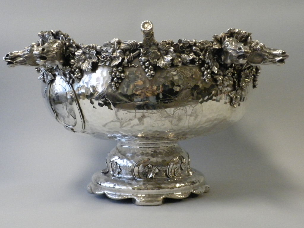 This is truly one of the most magnificent pieces of Tiffany & Co. sterling silver presentation pieces we have had in our collection.  The Punch Bowl and Ladle was made by Tiffany and presented as a gift from the Gentlemen’s Driving Association to