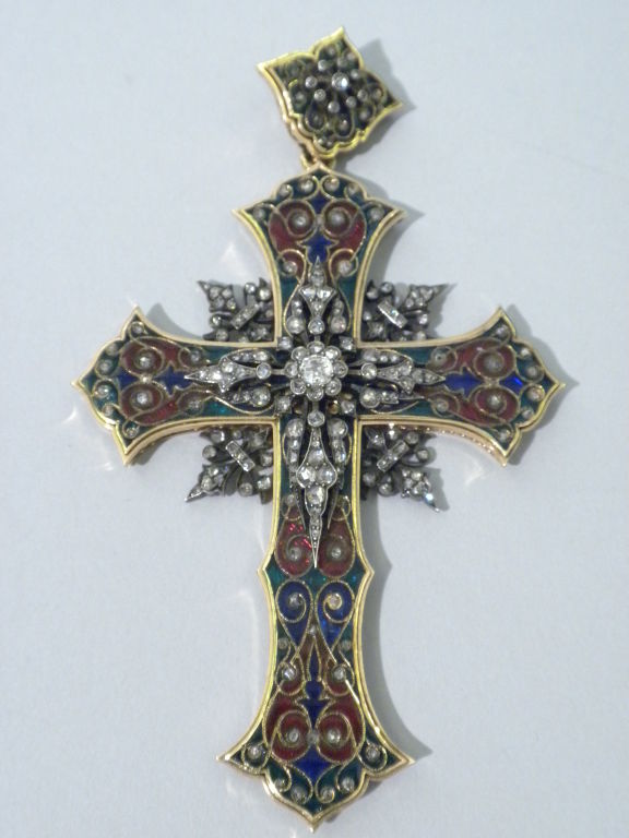 This is a magnificent late 19th Century 18 Karat Gold, Rose Cut Diamond and Basse Taille Enamel Cross Pendant, made circa 1880. This cross is exquisitely hand crafted and is set with small rose cut diamonds, further embellishing the beautiful basse