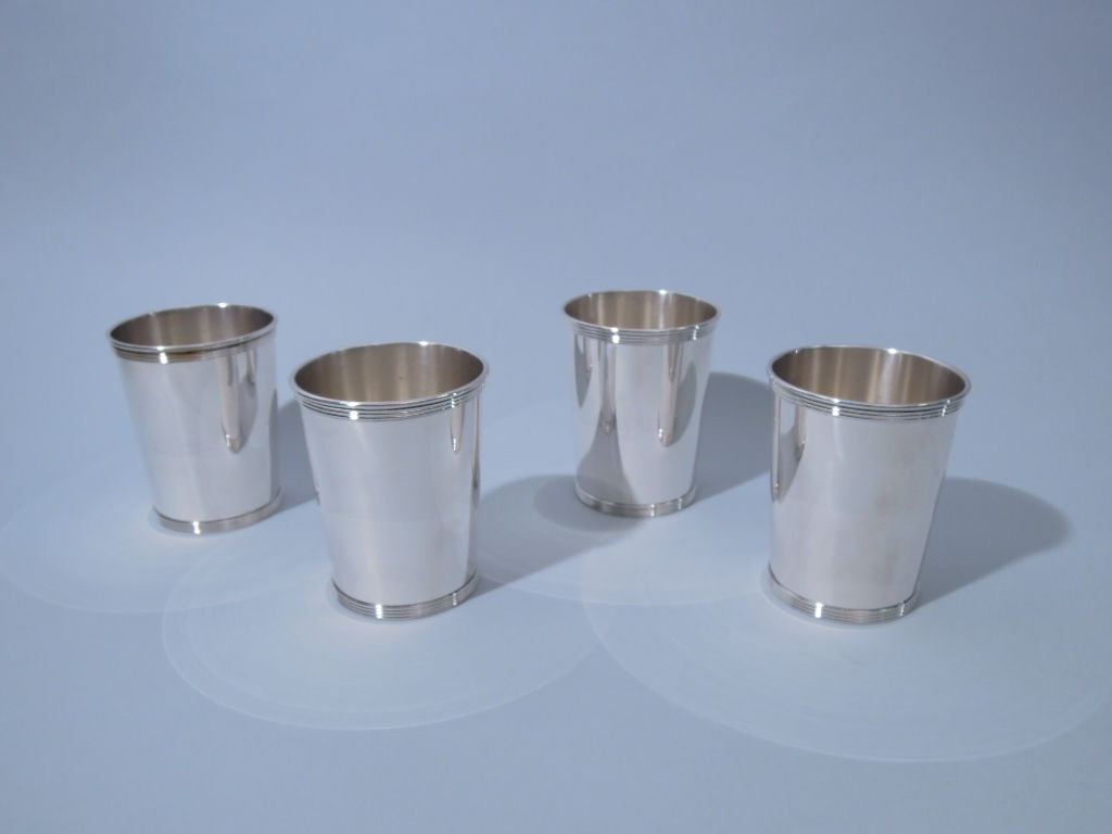 This is a pristine American Sterling Silver Set of 10 Mint Juleps made by Alvin Mfg. Co. of Providence, RI Circa 1950.  The tapered cylindrical cups are designed with reeded borders at the mouth and the foot.  Each is signed on the underside of the