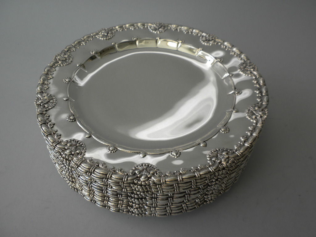 This magnificent set of 12 Tiffany & Co. Sterling Silver Dinner Plates is the same pattern as a set made for J.P.Morgan in 1895. The Morgan set is documented in Charles H. Carpenter, Jr.’s book, Tiffany Silver, page 69 figure 86.  Apparently, this