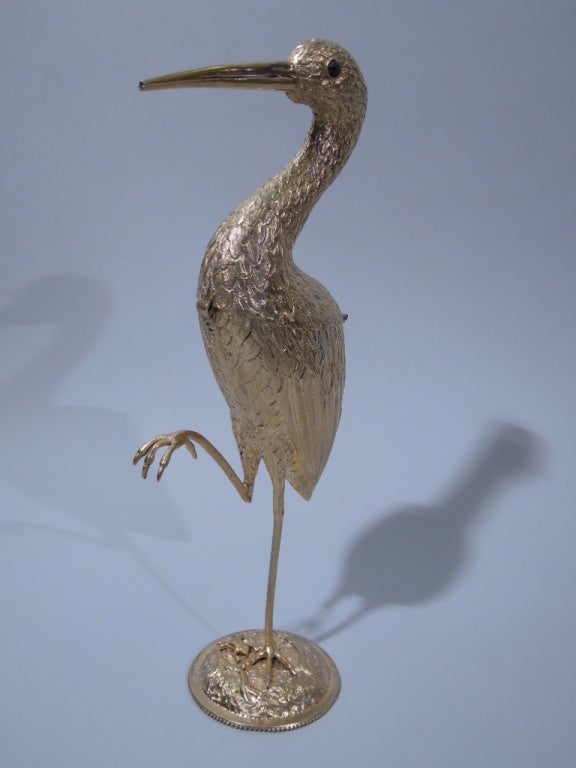 This Circa 1900 figural box is quite large measuring 12 ½ inches in height. It is lightly gilded on both the exterior and interior and has a hinged opening in the middle of the bird’s body. It is very realistically embossed with very fine feather