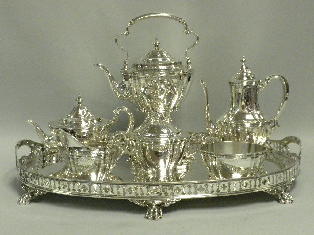 This elegant 7 Piece Tea and Coffee Service by Tiffany & Co., New York, was made Circa 1910 in the English Edwardian style.  The set includes:  a Coffeepot, Teapot, Kettle on Stand with burner, Covered Sugar Bowl, Creamer, Waste Bowl and a beautiful