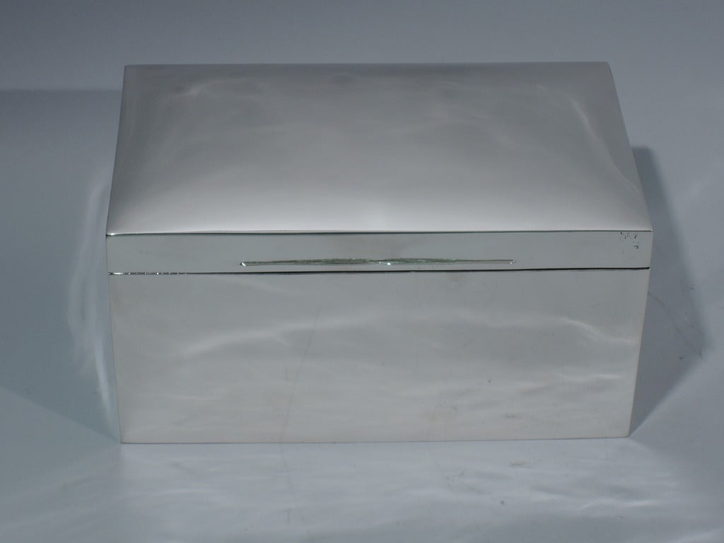 Large Victorian sterling silver box made by Mappin & Webb in London, 1899. Box is rectangular. Cover is curved and hinged, with double tabs. Box and cover interior are cedar lined and partitioned. Hallmarked. Excellent condition with crisp corners.