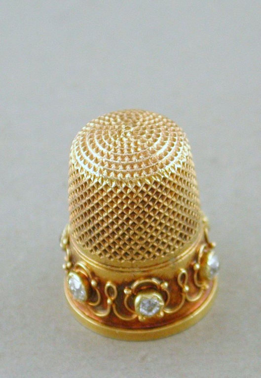 18kt yellow gold sewing thimble accented with diamonds and with its own box