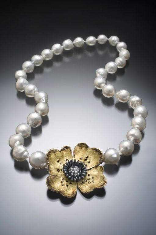 Designed by artist/jeweler Rebecca Myers this beautiful contemporary piece combines 18K yellow gold, oxidized silver and black and white pave set diamonds.($4,800 w/o pearls)  Fitted as brooch or pendant. Shown on graduated Baroque White Tahitian