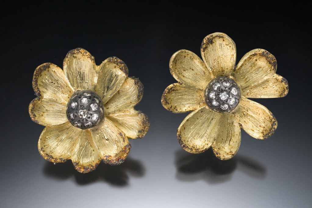 Artist / Jeweler Rebecca Myers has created these striking and adaptable Posie Earrings. The petalled outer jacket can be removed and the oxidized sterling silver and diamond centers worn separately as studs.