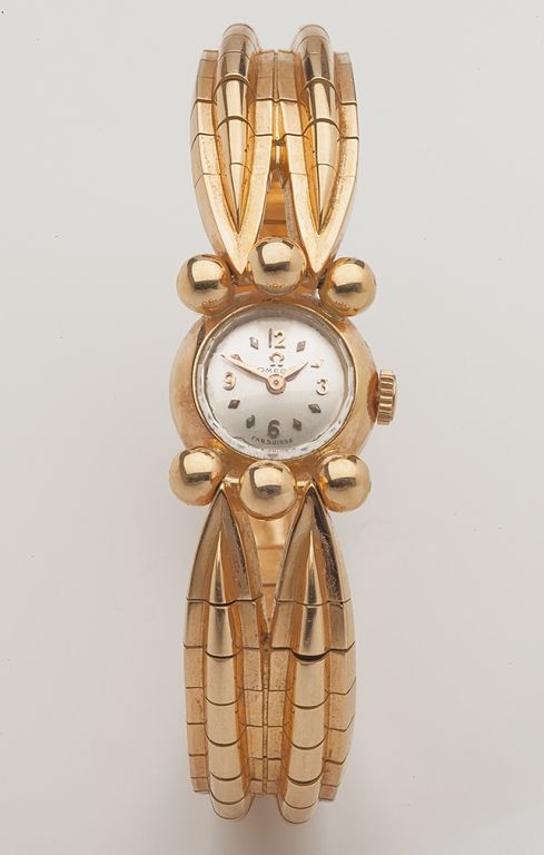 A sculptural and uniquely designed lady's Omega watch, the bracelet with French maker's mark, adjusts to two lengths, 18k yellow gold