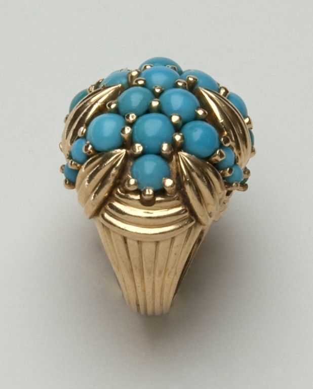 This highly original turquoise and gold ring typifies the best of 1950s glamour and design.  The ring is exquisitely made and is stamped “18K”, finger size 4.5