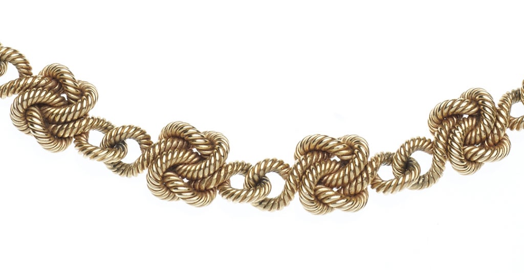 A rare and stylish circa 1960 Cartier 18 karat yellow gold necklace featuring graduated sailor's knots. Signed Cartier and numbered 05194 with the maker's mark and French export stamps.  Length: 17.25