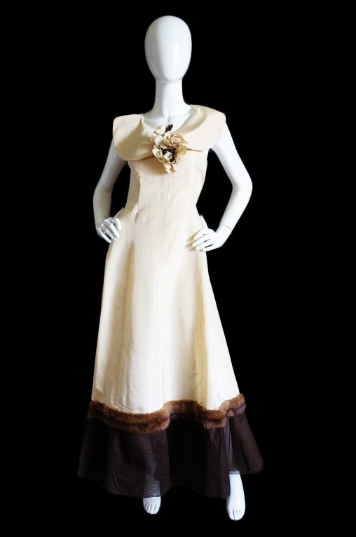 This is a beautifully constructed and very pretty, silk taffeta gown in a rich cream color that most likely dates to about 1945 based on the feedback I have had from of my contacts through 1st Dibs. Lucien LeLong was know for his wonderfully