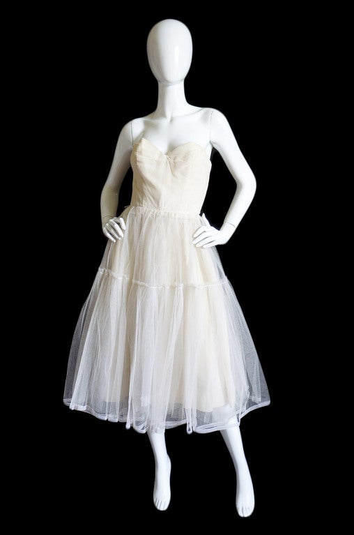 This is a very rare piece that is extremely hard to find Couture Pierre Balmain piece. This is a full underdress/ foundation garment meant to wear under an exterior dress. Its base is constructed and made as well as you would expect from a proper