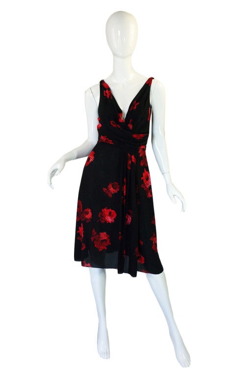 This is a fantastic little dress and one of the most recognizable prints from Prada. It is constructed from a gorgeous custom screened silk crepe that is one level up from chiffon as far its weight but has an opaqueness that a chiffon would not