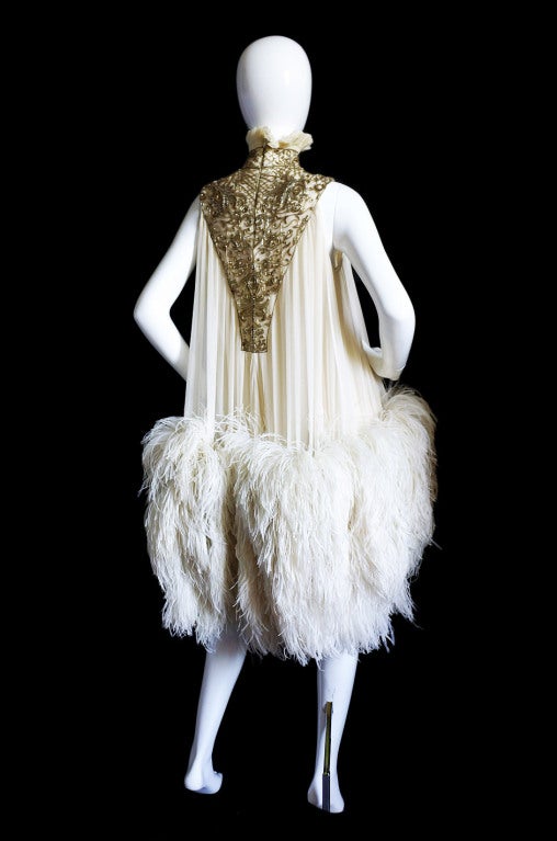 It is always an honor to have a piece of couture in the shop and to have a dress from the great Alexander McQueen is even more special! From the Fall 2006 “Widows of Culloden” collection,  this feather dress was produced in three shade - the olive,