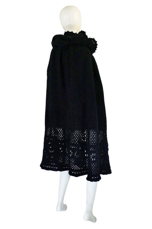 Sybil Connolly pieces are very rare things and this fantastic hand crocheted cape is one of two that I believe where made and the only other example is not labeled as this one is and a slightly different length. Hand done from a thick black yarn, it