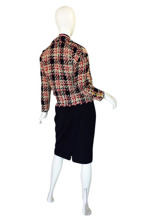 A rare and wonderful find, this is am amazing and complete three piece suit by Chanel! Everything about it showcases how gorgeous clothing can be when attention is paid to every last detail. Absolutely beautifully cut and classic Chanel! Just the