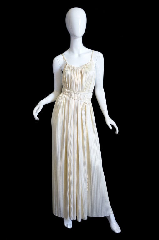 I have two identical Halston Goddess dresses for you and it is one of the best designs that he ever did! Made of a fluid perma pleated cream jersey this sexy silhouette was made infamous by Pat Cleavland and that picture of her in an almost