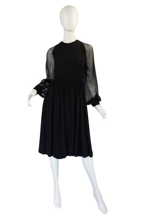 This wonderful little black dress is a testament to the greatness of James Galanos who was one of the great American Couturiers. Every detail on it is perfect and every seam is placed to ensure that the dress falls and sits properly once on and