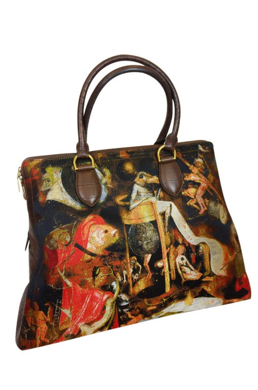 Fine art and high fashion meet in this beautiful piece from the last collection designed under the direction of Alexander McQueen himself. The bag pays homage to the religious paintings of Hieronymus Bosch and is made from a custom screened jacquard