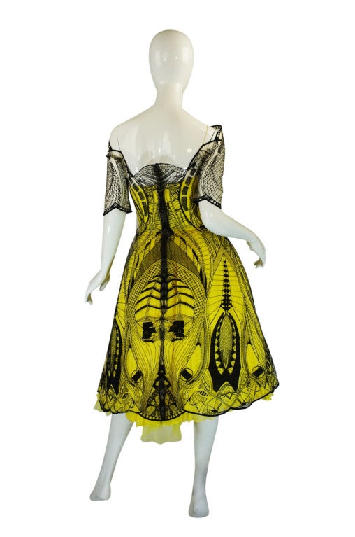 A once in a life time opportunity this is a very rare and wonderful McQueen dress! Only three of these were made for the North American market and it was the star of the Resort 2010 runway show. It was made even more infamous when Drew Barrymore