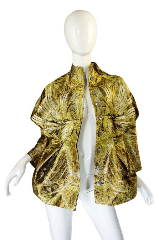 The final collection was cut on the stand by McQueen and the pieces are the last produced by him. The instantly sold out world wide and are the absolute hardest and most precious of all his work. I am immensely pleased to offer this suburb gold silk