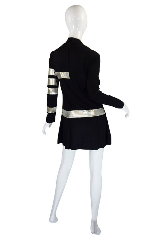Amazing and rare youth quake movement, black jersey mini dress from the cult label Paraphernalia. It is amazing and very bold! The cut of the dress is very simple and represents the time perfectly - a high neck tops a skinny sleeved shift that