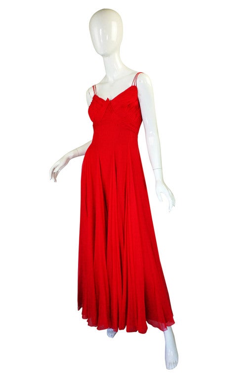 This gown is insanely gorgeous and in person it is even more so. The color was very hard to photo - it has a definite pink undertone and is that magical color that lands squarely between red and pink and is partly dependent on the light in deciding.