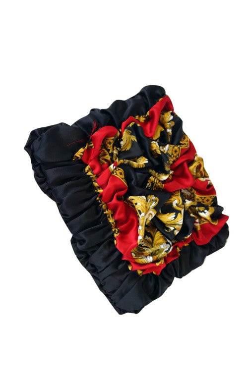 Cherie chose the 1980s fine silk scarf fabric that now has its original Peter Nygard signature tucked in discreetly amongst its fold. Marketa hand draped and meticulously stitched each drape into place to conform with the original design and still