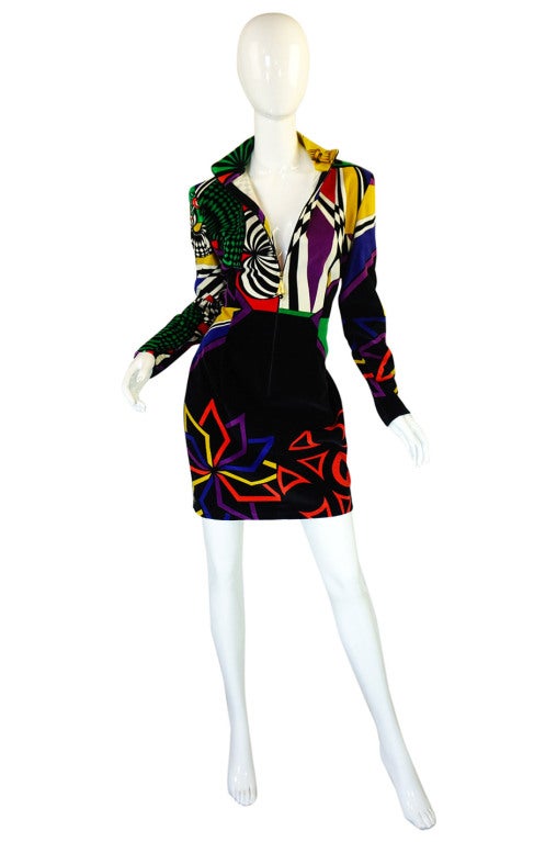 This is just classic, covetable Versace Versus dress! It is an insane and instantly recognizable controlled chaos of color done on a plush cotton velvet. The velvet allows the colors to be as crisp and bright as you would wish them to be and the cut