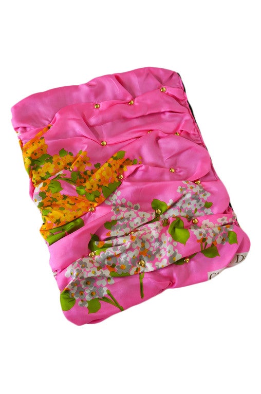 The 1960s fine silk scarf fabric was chosen by Cherie because of its amazing bright pink hue! That mixed with the pretty pastel floral print is just darling! The original Christian Dior signature now shows along the upper edge of the bag! Marketa