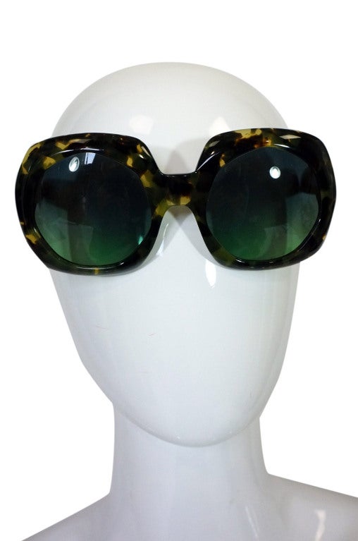 Oliver Goldsmith is an icon who began making hand made sunglasses in the 1960s. Everyone who was anyone wore them from Audrey Hepburn in Breakfast at Tiffany's to Grace Kelly. This is an incredible super sized hand made pair in a stunning green