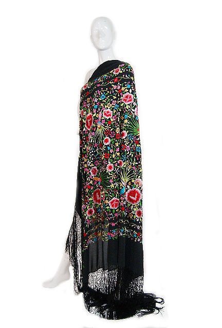 New Price<br />
<br />
Unbelievable embroidered silk Chinese export shawl c. 1920s or earlier. A spectacular explosion of flowers done in a fine satin stitch. The colors are as vibrant as the day it was done and are perfectly set off against the