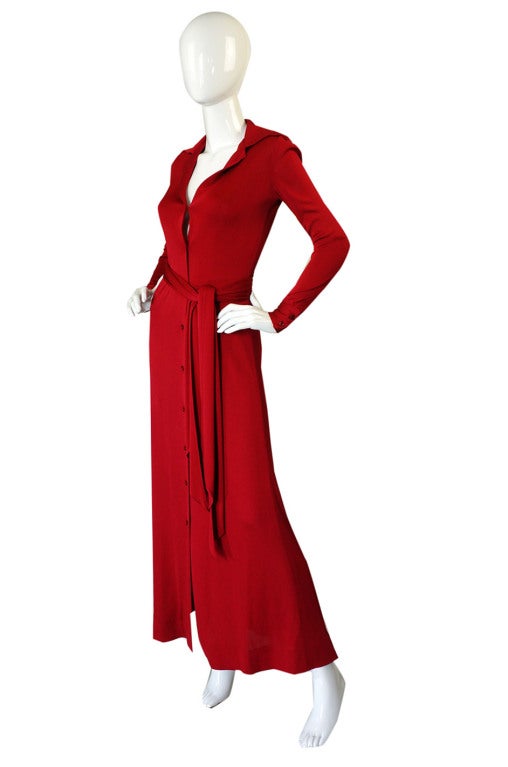This 1972 dress is the red version of the one peeking above Halston's shoulder in the picture included in this listing. I doubt many in this particular color were made - this one as a special order - along the seam of the skirt there is a Bergdorf