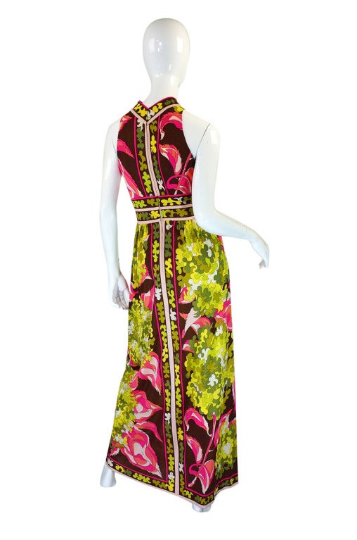 This is a near twin to a Pucci I had on the site a long time ago but this one is a halter version. It is classic Pucci done in a gorgeous palette of soft hues of greens have vibrant pink flowers worked amongst the pattern. The fabric is his