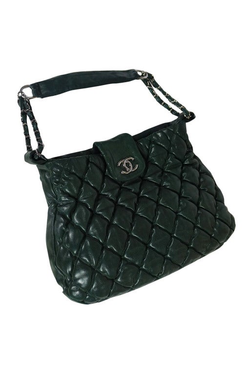 This is a stunning 2008 Chanel tote bag in a deep beautiful green. The leather is quilted and has a 
