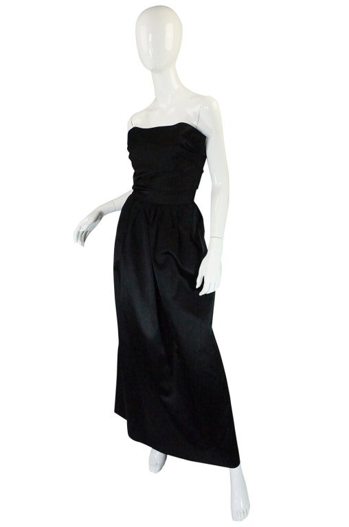 This is very beautiful late 1970s gown by Trigere and is shockingly beautiful to see in person and equally astounding when you actually get to see the level of construction and the pure beauty of the fabric. Constructed from that a luxurious balck