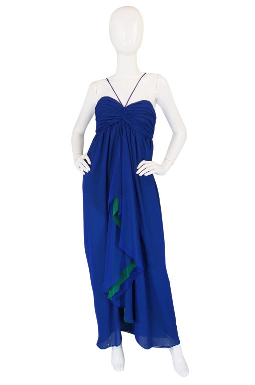 I love this floating confection of a dress made from layers of rich royal blue with a stunning pop of green mixed in down the front. The upper bodice is gathered in almost bikini style to create shape. I love how the straps come up from the center