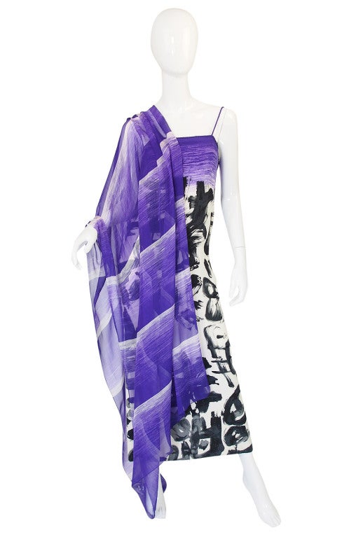 I decided to re-post this Hanae Mori dress so it gets the fresh eyes on it that it deserves. It is very beautiful and striking with its stark color palette of black and white combined with a royal purple. The graphics that cover the surface suggest