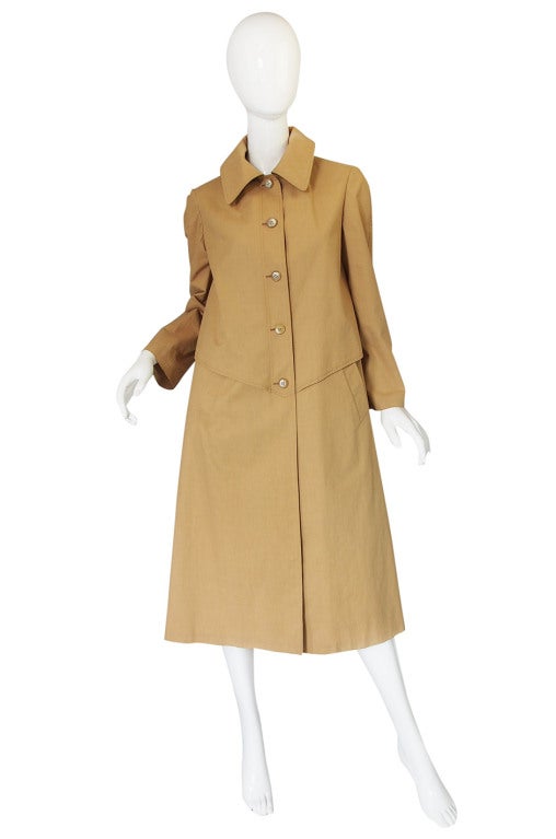 Like it stepped out of a time capsule comes this amazing and very rare Hermes coat from the late 1950s, early 1960s. I don't think you can possibly find a more classic coat them this Macintosh design and it is as chic now as the day it was made.