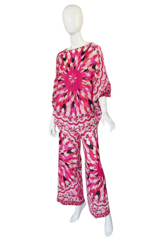 Absolutely gorgeous early 1960s silk chiffon printed Emilio Pucci tunic and pant set that is in the most coveted of all the Pucci colors - PINKS!! Made of a pretty silk chiffon that gives it a lighter and airier feel then the silk jerseys he used