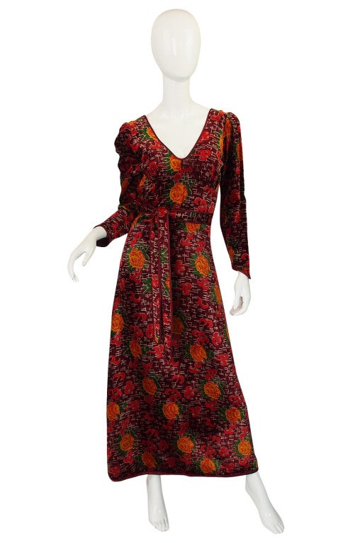 Love this panne velvet early Alley Cat wrap dress by Betsy Johnson. It actually wraps and closes at the back and then ties at the front - a clever little twist on a classic design. This also allows a deep and sexy plunge on the front and the back.