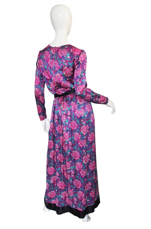 I love this 1970s Chanel Creations maxi dress! the colors are absolutely sublime - it is a delicate and feminine mix of deep pinks, turquoises and azure blues. The fabric chosen is a silk satin so it gives the floral print a bit of a sheen and a
