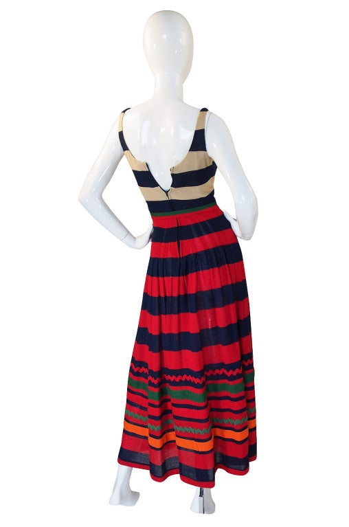 This 1970s striped, light weight knit maxi dress from Lanvin is fabulous! The colors are bright but without being too much and I love how it goes from a classic , almost nautical feel with the cream and navy at the bodice to a riot of colors and