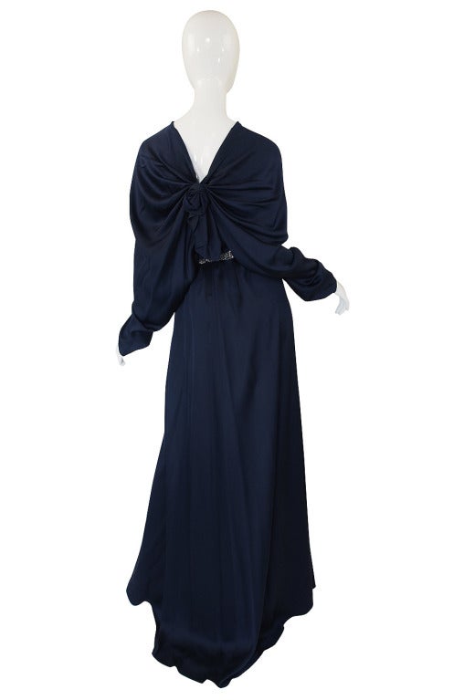 The silk on this dress is a stunning deep midnight blue that seems to glow from within because of the fabric choice. It is made from a sensual feeling, heavy liquid silk and the draping effect this fabric creates is what makes this dress