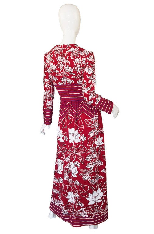 A fabulous Lanvin poly jersey dress from the 1970s in a deep red mixed with stark white and with a pop of purple! It has a great simple rounded neckline and long sleeve - the bodice has an almost T-shirt feel it. The waist is defined with the