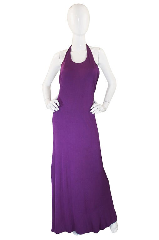 An amazing and extremely rare set from Halston that is from the 1971 collection. Both pieces are done in a stunning purple silk jersey. The dress is made of a double layer of this fabric and the evening coat a single layer. One of Halston's