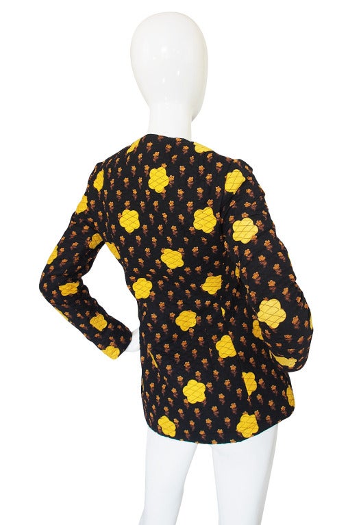 A stunning applique early 1970s Givenchy jacket that I am in love with! As you get closer to this piece you realize that not only is it quilted but that all the larger yellow flowers are individually cut, hand placed and then quilt stitched into