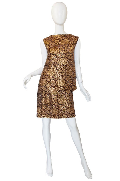 This Dior set perfectly symbolizes the lady who wore Dior but also wanted to feel glamorous and chic. The fabric is absolutely stunning and is just divine! It is woven gold thread lame brocade with a raised design that gives it a remarkable texture.